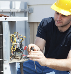 Technician Repairing HVAC Unit